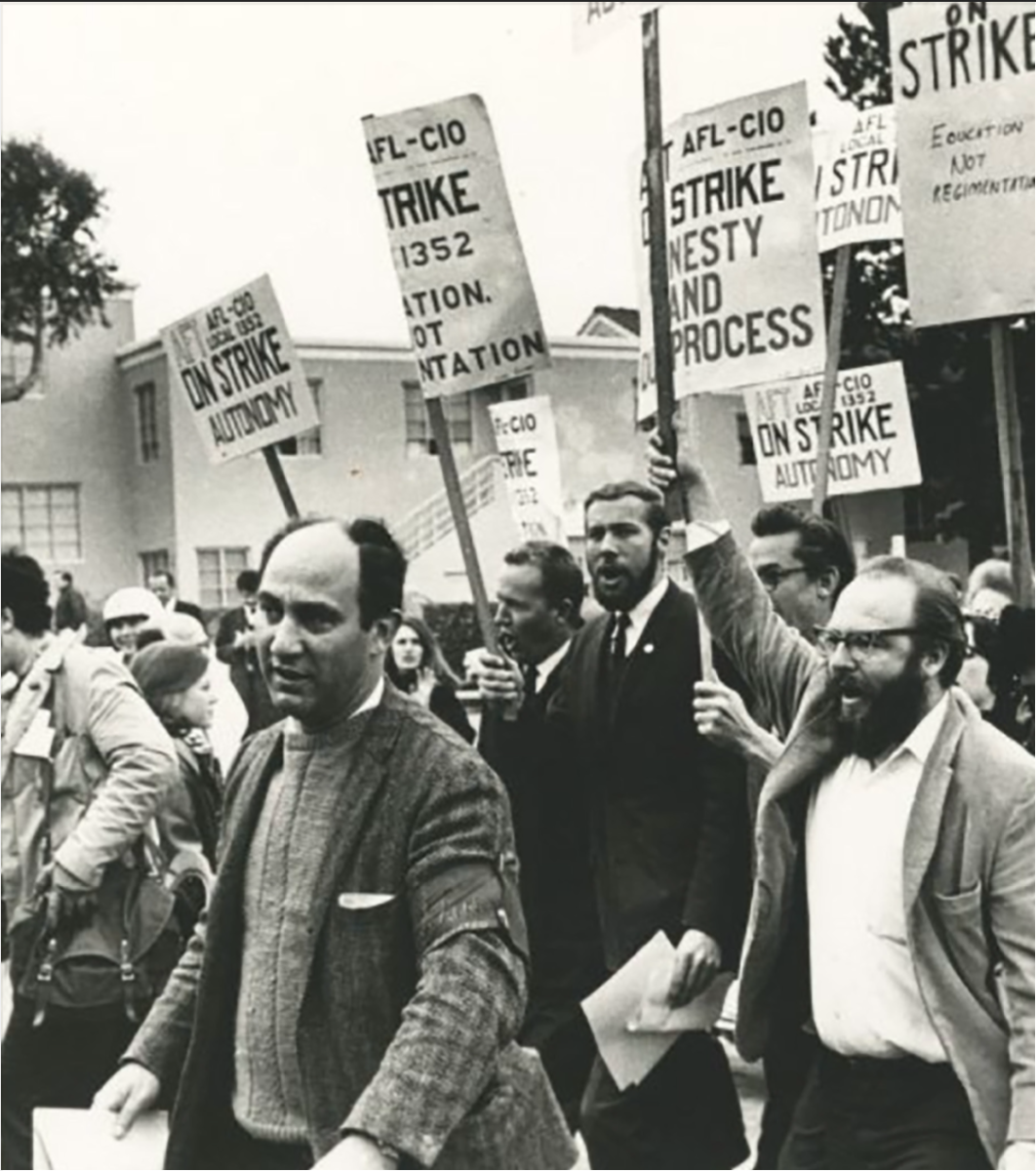 The American Federation of Teachers marches with picket signs during the ethnic studies strike of 1968. (Terry Schmitt/Courtesy of University Archives)